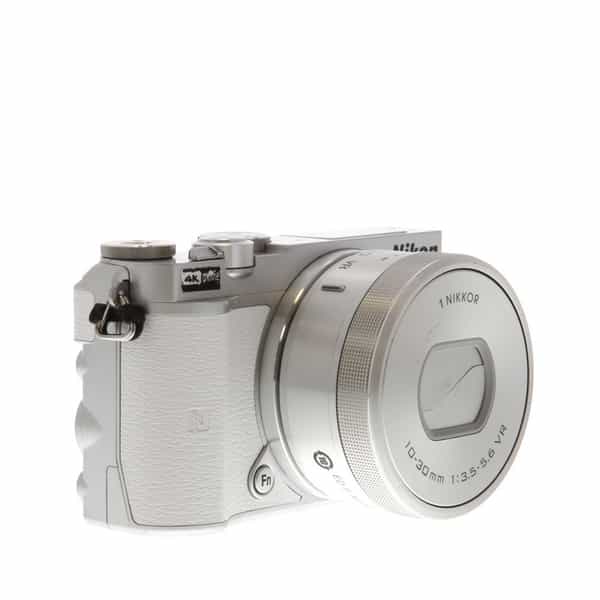 Nikon 1 J5 Mirrorless Digital Camera, Silver Body with White Leather  {20.8MP} with 10-30mm f/3.5-5.6 VR PD-Zoom Lens, Silver at KEH Camera