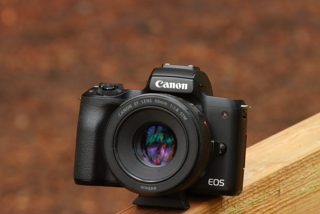 Canon EOS M50 Mark II - Expert Advice Canon EOS 5D Mark II sitting on a wooden ledge