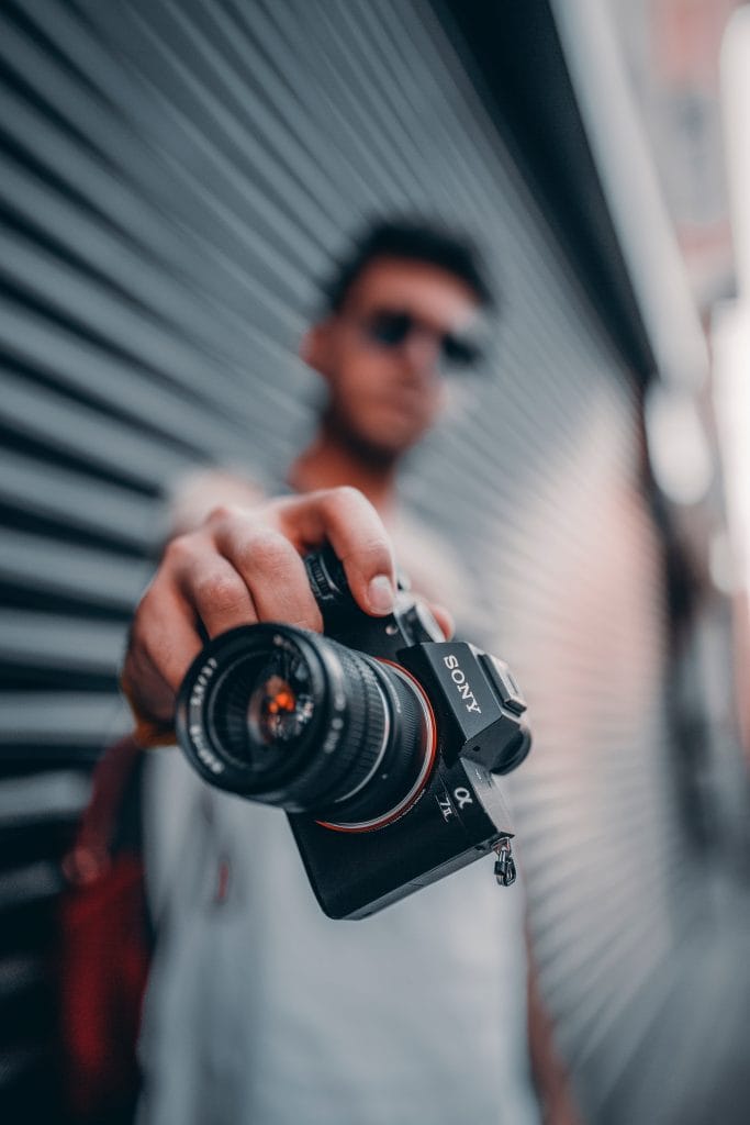 Sony Alpha 7 II (a7 II) - Expert Advice Man holding Sony a7 II camera