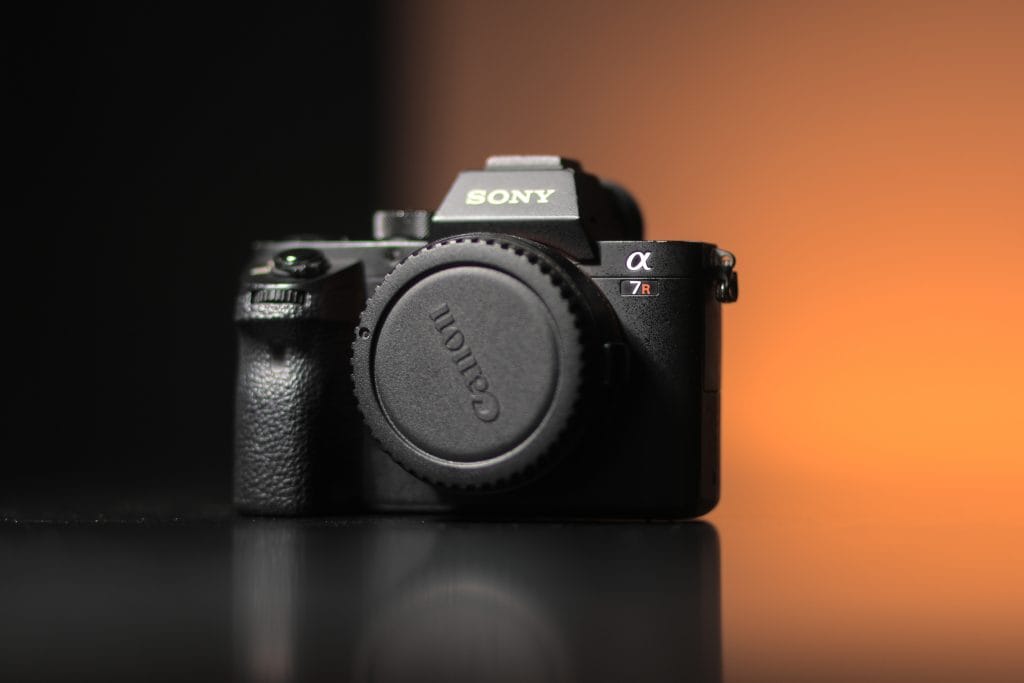 Sony a7R II - Expert Advice Sony a7R ii mirrorless camera sitting on a reflective surface
