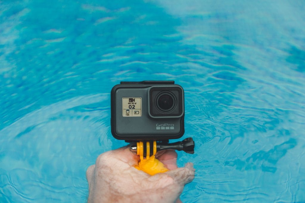 - Expert Advice gopro camera for underwater photography held above pool