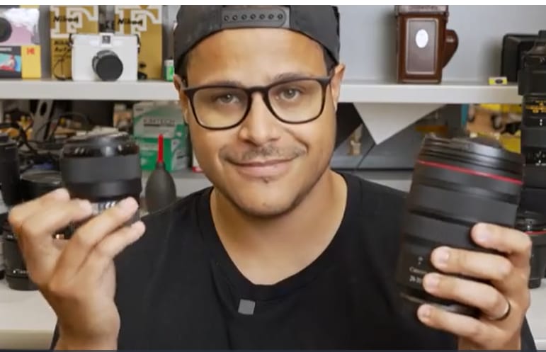 Camera Academy - person with camera lenses in hand