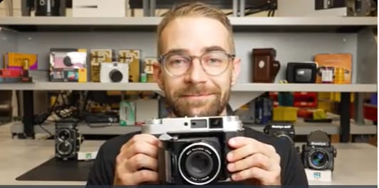 Camera Academy - person with camera in hand