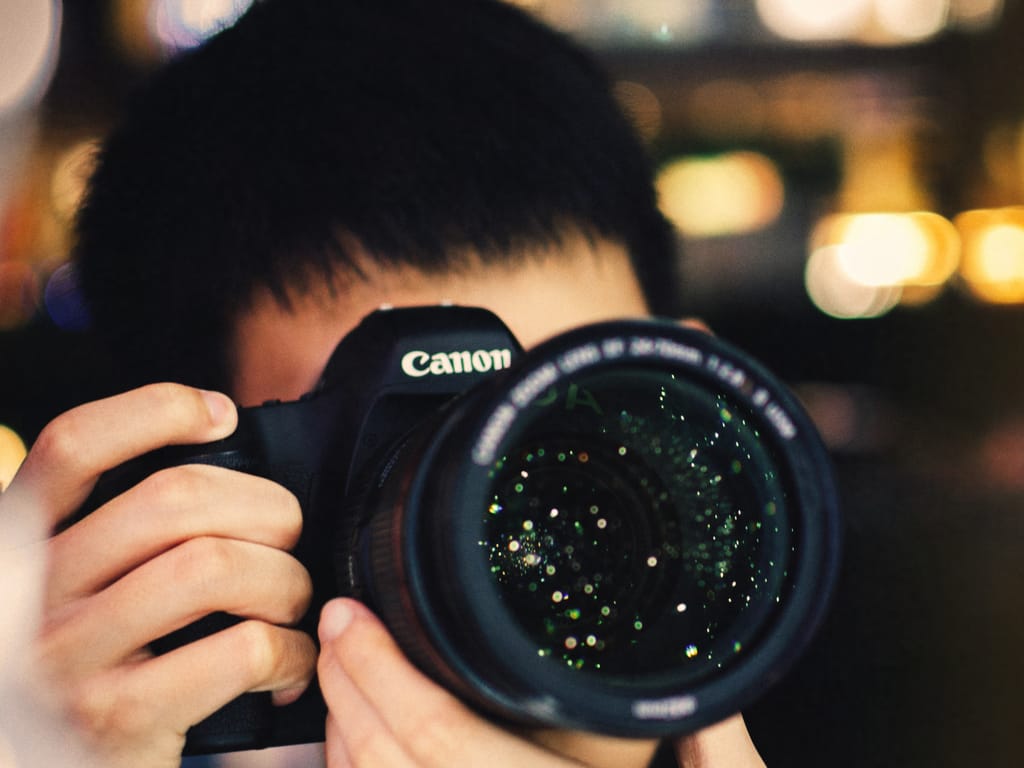 Person clicking pictures with camera