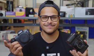 Camera Academy - person with cameras in hand
