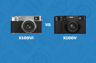 Comparison graphic showing the Fujifilm X100VI camera in silver and black on the left labeled 'X100VI', versus the Fujifilm X100V camera in all black on the right labeled 'X100V', separated by a 'VS' on a blue background with a subtle camera-icon pattern.